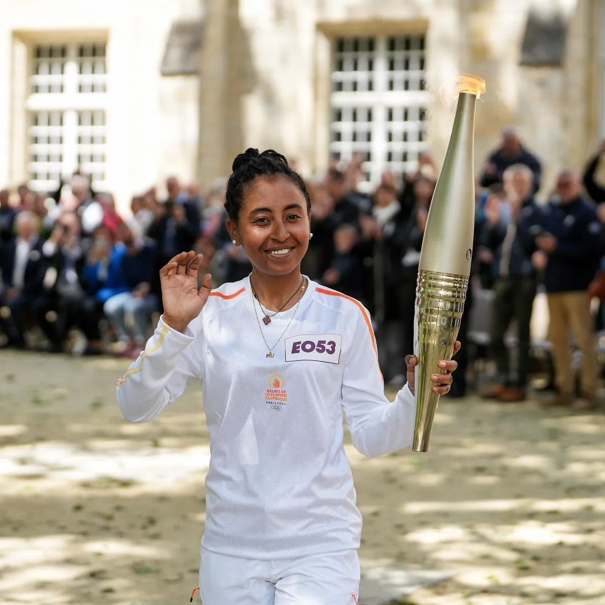 Eyeru Tesfoam Gebru carrying the Olympic torch in Bayeux  IOC Refugee Team
